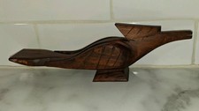Hand carved vintage wooden roadrunner, intricate, MCM, retro picture