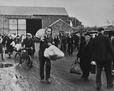 French civilians carrying their belongings luggage sacks as they m- Old Photo picture
