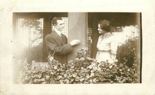 Vintage RPPC Couple Balcony Flirting Flowers Early 1900s Real Photo Postcard picture