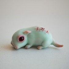 Turquoise weird sculpture of cute sad face minnie mouse picture
