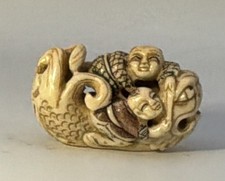 VTG Japanese Natsuke A Carved Koi With 2 People Riding It picture