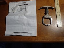 ANTIQUE IRON CLAW POLICE HAND CUFFS  1934-1935 ALL ORIGINAL  BX OBSOLETE ANTIQUE picture