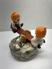 Vintage Wind Up Musical Raggedy Ann & Andy on See Saw Figurine Music Box picture