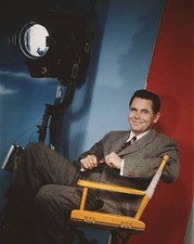 actor Glenn Ford sitting in front of a Columbia Pictures Corpor - 1957 Old Photo picture