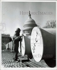 1959 Press Photo Worker Checks over Building Supplies near the Capitol in D.C. picture