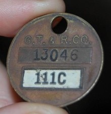 VINTAGE GOODYEAR TIRE & RUBBER  G.T. & R. BRASS ADVERTISING TAG AKRON OHIO picture