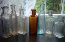 ANTIQUE 7 PIECE EMBOSSED 1880's- 1890's MEDICINE BOTTLE LOT picture