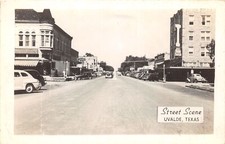 J38/ Uvalde Texas Postcard c1940s RPPC Street Scene Autos Stores 100 picture