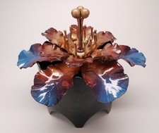 Handcrafted vessel, copper and glass enamel flower lid with a steel base. picture