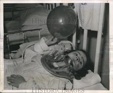1947 Press Photo Yvonne Scodellaro with Balloon & Doll Injured in Car Accident picture