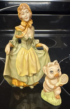 Ceramic Figurine fancy lady and ceramic tennis pig picture