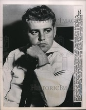 1951 Press Photo Aviation Machinist mate Tom Amburn seen waiting for his flight picture