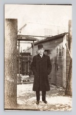 Antique RPPC  c. Early 1900s Dapper Man Bowler Hat Long Winter Overcoat Snow picture