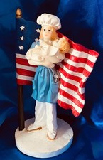 VINTAGE RED WHITE & BLUE PATRIOTIC AMERICAN FLAG FIGURINE NURSE HOLDING NEW BABY picture