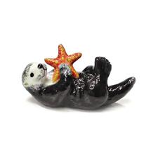Northern Rose Black - Sea Otter with Starfish - Miniature Porcelain Figurine picture