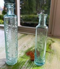 2 Vintage Clear Glass Embossed Medicine Bottles ST JAKOBS & KICKAPOO picture