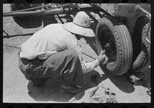 Photo:Ralls Texas 1939 Day Laborer Putting Cotter Pin by Tractor FSA Farm picture
