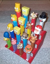 4 Teir PEZ Dispenser Display Holds 16 PEZ Color is Red - Dispensers Not Included picture