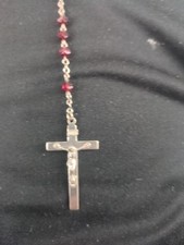 Vint image shows a Catholic rosary necklace featuring deep red crystal or glass picture