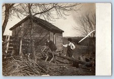 c1910's Men With Saw Cutting Lumber Cabin RPPC Photo Unposted Antique Postcard picture