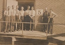 Real Photo 8 Men Standing at Factory Entrance #5 Ramp Occupational RPPC Postcard picture