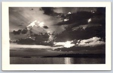 Vintage USA Postcard Dramatic Sunset Over Lake Clouds 1940s RPPC picture