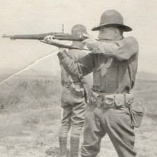 c1910s WWI US Army Soldier Aiming Rifle Campaign Hat Snapshot Photo Puttees Vtg picture