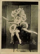 1924 Press Photo Dancer Lily Wilmer Poses in Costume on Top of Dresser picture