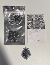 Playge “Levels of Black” Black Anodized Revolve Titanium Coin picture