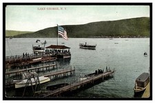 LAKE GEORGE NY VINTAGE POSTCARD 1900'S BOATS DOCKS AMERICAN FLAG GREAT IMAGE picture