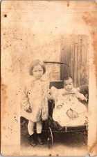 Antique RPPC Real Photo Postcard of Children with Baby Carriage, Early 1900s picture