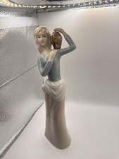 Vintage Glazed Porcelain Figurine Woman with Water Jug picture