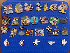Disney pin lot featuring Mickey and Minnie along with Pluto plus artist proof picture