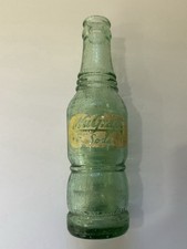 Vintage NuGrape Soda Green ACL Coca-Cola Bottling Co Bottle 10 oz Factory Flaw picture