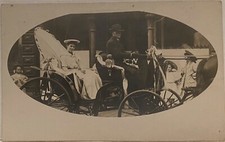 Real Photo Man Drives Parade Carriage~Pretty Woman Holds Large Key~RPPC Postcard picture