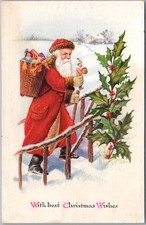 c1910s CHRISTMAS Embossed Postcard SANTA CLAUS in Red Robe / Basket of Toys picture