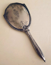 Antique silver-tone/likely silver-plated vanity hand mirror circa early 20th C picture