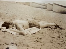Antique Snapshot Photo Woman Lying on Towel on Beach Boats in Background Vintage picture