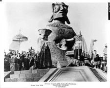 Group of people standing beside a large statue monument a scene fi- Old Photo picture