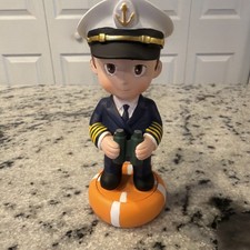 Cruise Ship Captain Figurine Standing On Life Ring Pedestal Cartoon picture