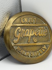 Vintage 1930s/40s Enjoy Grapette Soda Walk Safely Heavy Brass Sidewalk Marker picture