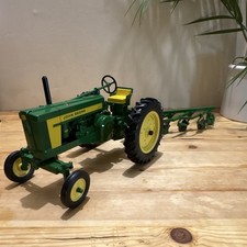 John Deere Green Diecast Tractor Toy with Plow Attachment 1:16 scale picture