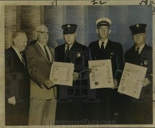 1961 Press Photo Fire Fighters and Certificates for Heroism, Saving of Life picture