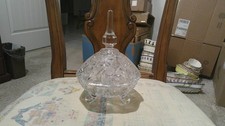ELEGANT CRYSTAL FOOTED BOWL PRESSED AND CUT WITH SPIRE LID APPROX. 6