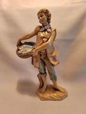 1986 Fontanini Figurine-Boy holding basket of fish #322 - 7.5