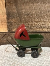 Vtg Wyandotte steel Metal Baby Doll Buggy Carriage red green rotates 4” picture