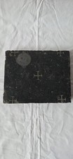 Black marble altar stone with a relic picture