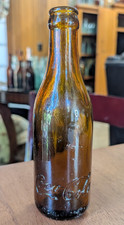 VINTAGE Amber Coca-Cola, Lexington KY, Heel & Base Script Tooled Top Soda Bottle picture