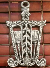 Vintage Pennsylvania Dutch Cast Iron Trivet Brooms & Wheat Sheaves Good Luck picture