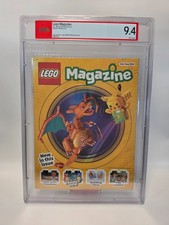 PSA 9.4 – CHARIZARD/PIKACHU LEGO MAGAZINE JULY - AUGUST 2026 picture